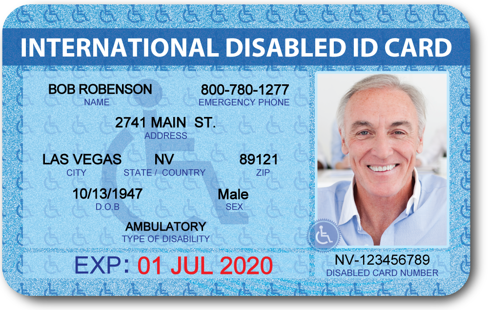 A disability identification card resting on a desk beside application paperwork.